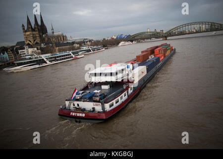 Cologne, Germany. 10th Jan, 2018. Ships sailing on the river Rhine in Cologne, Germany, 10 January 2018. The Rhine has been cleared for navigation once again after the rise in its waters' level. Credit: Rolf Vennenbernd/dpa/Alamy Live News Stock Photo