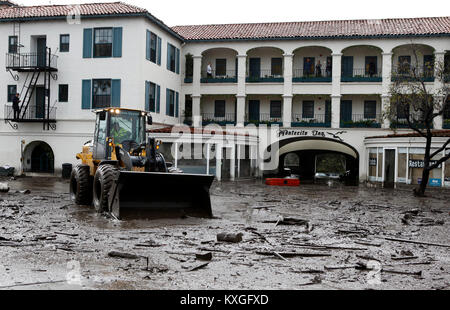 Montecito, California, USA. 10th Jan, 2018. Debris is cleared in front of the Montecito Inn in Montecito, Calif. Heavy rain brought flash flooding and mudslides to the area in Montecito, Calif. late on Tuesday, January 9, 2018. Credit: Daniel Dreifuss/Alamy Live News Stock Photo