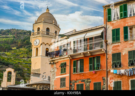 The Santa Margherita di Antiochia Church with it's bell tower and clock at the village of Vernazza, Cinque Terre Italy Stock Photo