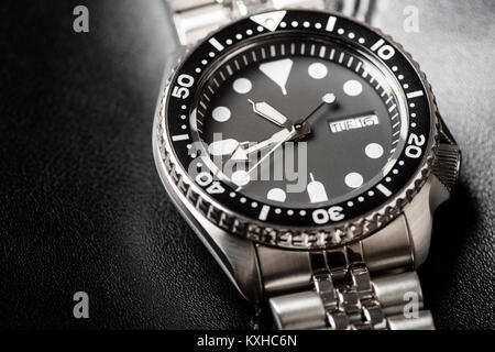 closeup men dive watch with stainless steel bracelet Stock Photo