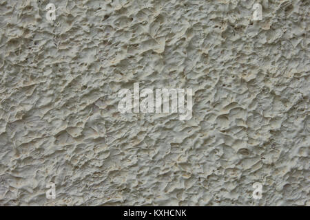 The grey grungy wall. White wall texture background. The plaster on the wall. Uneven wall surface. The paint on the wall. Plastered walls. Abstract Stock Photo