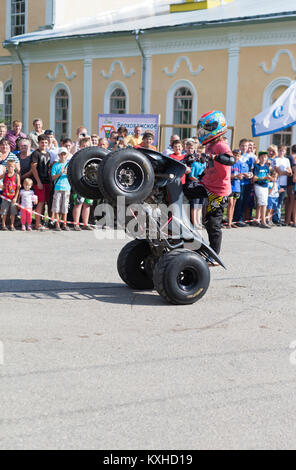 Verkhovazhye, Vologda region, Russia - August 10, 2013: Tricks on an ATV by Thomas Kalinin. Thomas Kalinin driving a motorcycle with 3 years old, he i Stock Photo