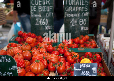 Fresh tomatoes on a display in a market in Provence, France. Stock Photo