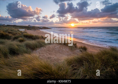 Constantine Bay at sunset looking towards Treyarnon Point on the North Cornwall coast. Stock Photo