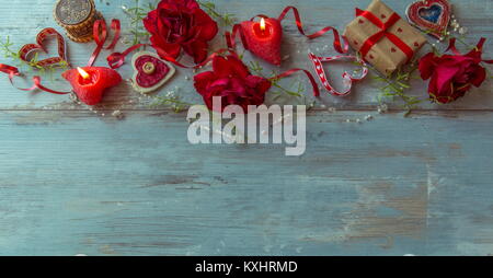 Valentines day background with red hearts, roses and candles, Valentine's day table place setting. Stock Photo