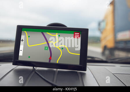 GPS (Global Positioning System) car navigation device, help and assistance with direction on road Stock Photo