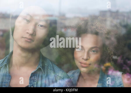 Close-up of couple seen through glass window Stock Photo