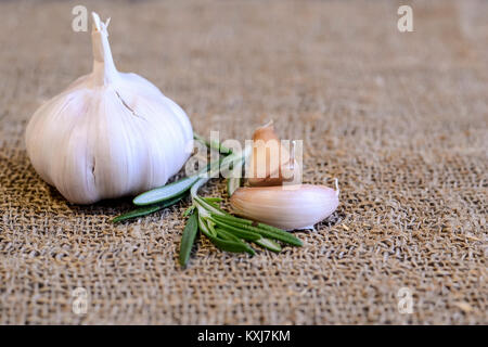 Garlic and cloves lying on a napkin. Healthy food and spices. Ad Stock ...