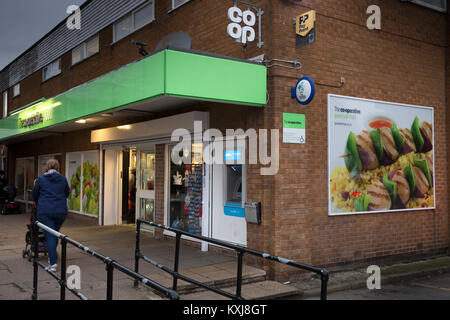 UK, England, Cheshire, Stockport, Bramhall, Dairyground Road, Co-op food store, with new cloverleaf logo sign Stock Photo