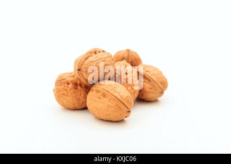 Walnuts in shell on white background Stock Photo