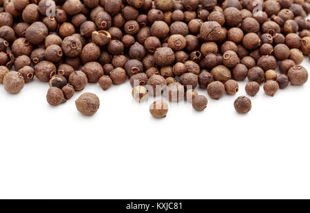 Allspice seeds on white background Stock Photo