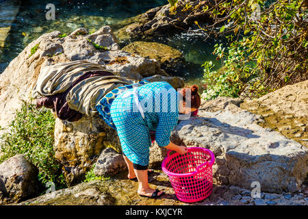 Chefchaouen, MOROCCO - DECEMBER 8: Woman doing laundry in the river in Chefchaouen. December 2016 Stock Photo