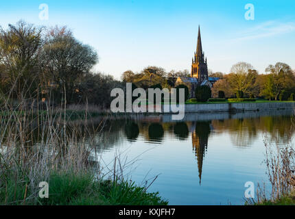 Church reflecting in lake at Clumber Park Stock Photo