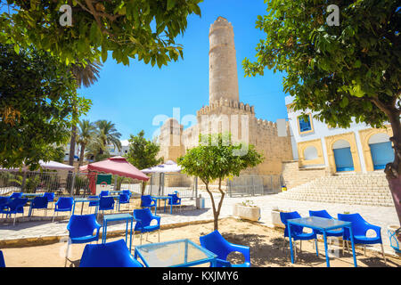 Cityscape with street cafe and view of ancient fortress in Sousse. Tunisia, North Africa Stock Photo