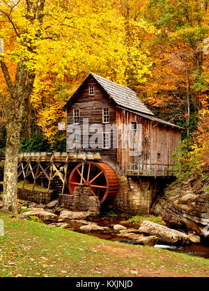 Iconic Babcock Grist Mill surrounded by vivid autumn colors. West Virginia Stock Photo