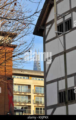 an unusual or different viewpoint of the shard office building in central London with shakespeares globe theatre on the south bank of the river thames Stock Photo
