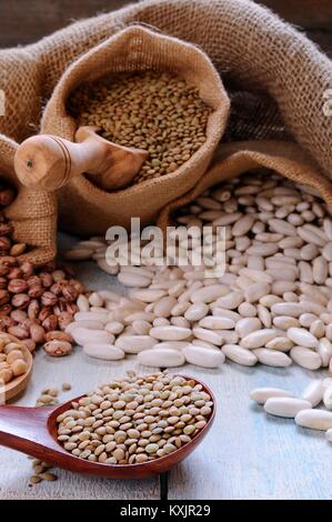 Close-up of various cereals in textile bags and spoon Stock Photo