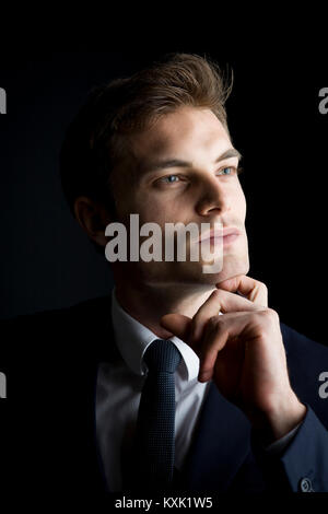 caucasian man pose on black background Stock Photo