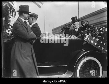 President Woodrow Wilson and his wife Edith in an open parade car on tour seeking support of the League of Nations. September 1919. Image from 5 x 7 inch glass negative. Stock Photo