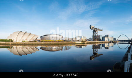 View of SEC Armadillo and SE Hydro beside River Clyde on blue sky winter day, Scotland, United Kingdom