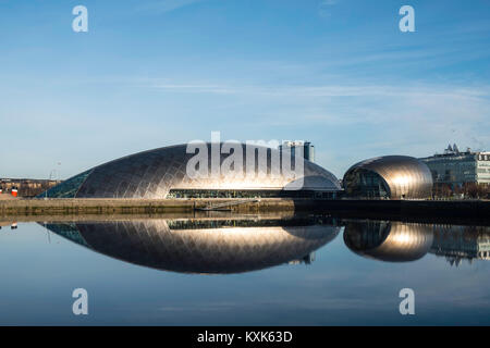 View of Glasgow Science Centre North Quay and IMAX Cinema beside River Clyde on blue sky wintery, Scotland, United Kingdom Stock Photo