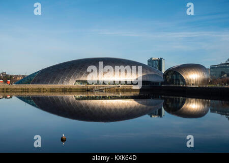 View of Glasgow Science Centre North Quay and IMAX Cinema beside River Clyde on blue sky wintery, Scotland, United Kingdom Stock Photo