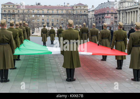 Formation of soldiers with the Hungarian flag during the 15 March military parade, Budapest, Hungary. Hungarian National Holiday. Stock Photo