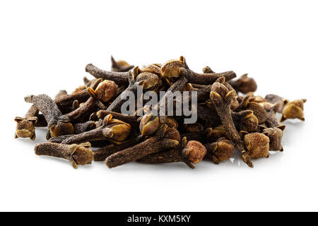 A pile of dry cloves isolated on white. Stock Photo