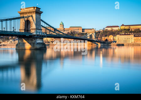 Budapest Castle and famous Chain Bridge in Budapest early morning. Focus on the bridge. Stock Photo