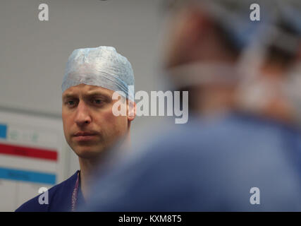 The Duke of Cambridge observes surgeons conducting a robotic assisted tongue base hemiglossectomy surgery on patient Anne White, 67, during his visit to the Royal Marsden NHS Foundation Trust in London. Stock Photo
