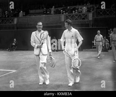 German tennis player Gottfried von Cramm (left) with Don Budge of the USA walking on to the centre court for the Men's Singles final in the All-England Chamionships at Wimbledon 1937  July 02, 1937 Stock Photo