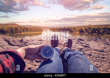 Hand of person holding compass Stock Photo