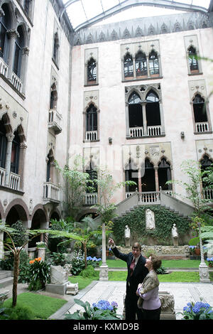 Stan Kozak, Chief Horticulturist of the Gardner Museum, guides Mrs. Laura Bush though a tour of the interior courtyard garden, Tuesday, April 24, 2006, during a visit to the Isabella Stewart Gardner Museum in Boston. The museum is modeled after a 15th century Venetian Palazzo, turned inside out and surrounding the courtyard.  Mandatory Credit: Shealah Craighead / White House via CNP /MediaPunch Stock Photo