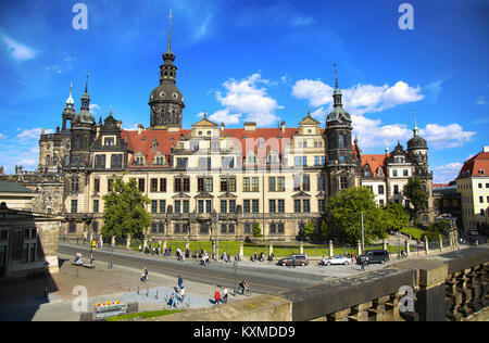 DRESDEN, GERMANY – AUGUST 13, 2016: Tourists walk on Sophienstrasse street and majestic view on  Saxony Dresden Castle (Residenzschloss) in Dresden, S Stock Photo