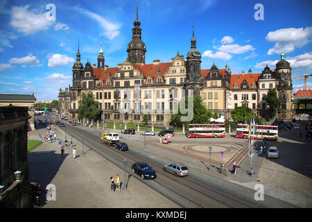 DRESDEN, GERMANY – AUGUST 13, 2016: Tourists walk on Sophienstrasse street and majestic view on  Saxony Dresden Castle (Residenzschloss) in Dresden, S Stock Photo