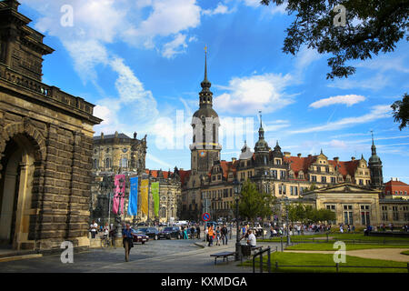 DRESDEN, GERMANY – AUGUST 13, 2016: Tourists walk on Theaterplatz street and majestic view on  Saxony Dresden Castle (Residenzschloss) in Dresden, Sta Stock Photo