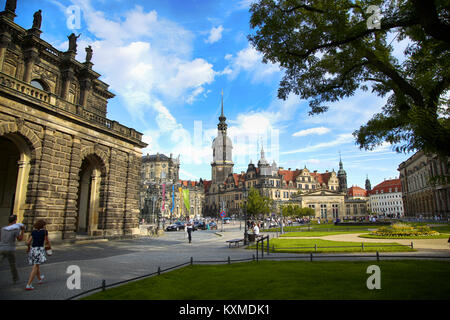 DRESDEN, GERMANY – AUGUST 13, 2016: Tourists walk on Theaterplatz street and majestic view on  Saxony Dresden Castle (Residenzschloss) in Dresden, Sta Stock Photo