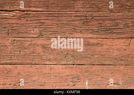 old red painted wood background with cracked and peeling paint Stock Photo