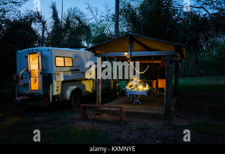 Campervan parked on campsite by picnic shelter at night,Bonito,Mato Grosso do Sul,Brazil,South America Stock Photo