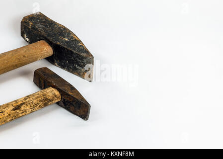 A set of two old and worn hammers isolated on white background Stock Photo