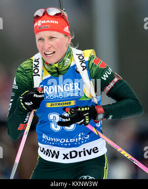 Ruhpolding, Germany. 11th Jan, 2018. Biathlete Franziska Hildebrand from Germany jumps back into the race at Chiemgau Arena in Ruhpolding, Germany, 11 January 2018. Credit: Sven Hoppe/dpa/Alamy Live News Stock Photo