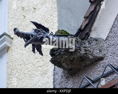 SALZBURG, AUSTRIA - DECEMBER 05, 2017:  Ornate drainpipe waterspout on building in form of a Dragon Stock Photo