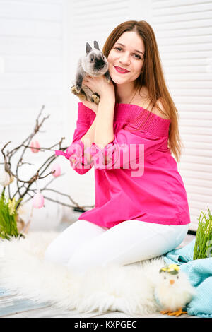 Young woman with rabbit Stock Photo