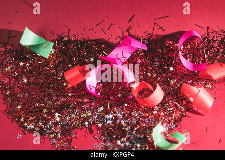 big christmas confetti and sparkles on pink background Stock Photo