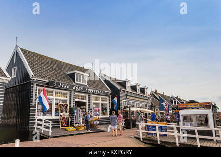 Tourists checking out souvenir shops at the dike in Marken, Holland Stock Photo