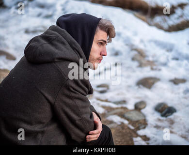 Young man posing in snow with umbrella in hands 1259926 Stock Photo at  Vecteezy