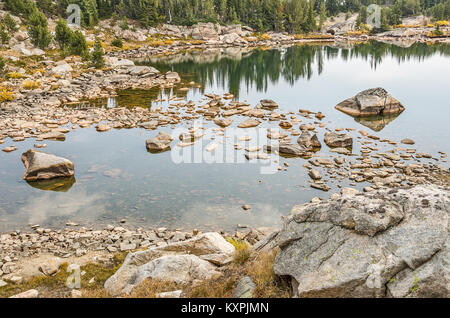 Calm lake with rocks and nice reflections along the Beartooth Highway