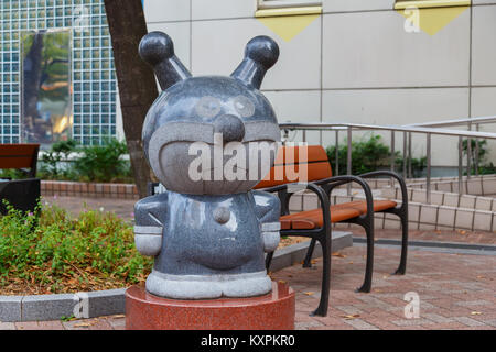 KOBE, JAPAN - OCTOBER 26: Anpanman Character in Kobe, Japan on October 26, 2014. Stone sculptures of the renowed Japanese cartoon 'Anpanman' nearby th Stock Photo
