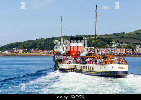 The Waverley Paddle Steamer departing from the town of Largs on the Firth of Clyde, North Ayrshire, Scotland UK Stock Photo