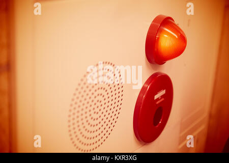 Emergency light wall panel and alarm speaker sound in the office building. Stock Photo
